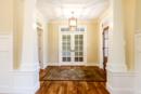 Foyer with tapered craftsman columns - New Home